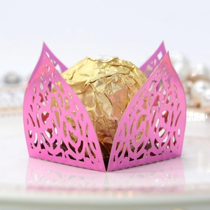 Close-up of rose red laser-cut lace candy box wrapper for chocolate party favors