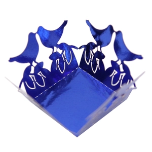 Macro detail of laser-cut bird pattern on dark blue metallic wedding favor box