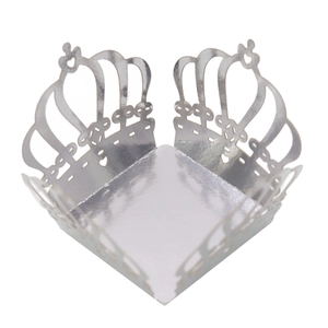 Macro shot of silver laser-cut crown candy box with mirror finish for party favors