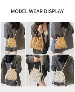 Detail of woven straw bucket bags in khaki and beige with hollow diamond patterns