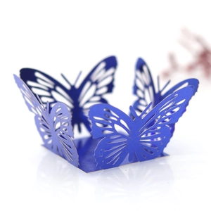 Detail shot of laser-cut butterfly wedding cake border in pearlized navy blue finish
