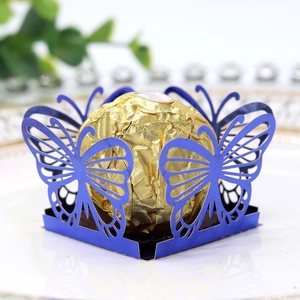 Macro detail of laser-cut blue butterfly candy holder with elegant hollow wings