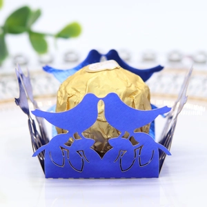 Blue laser-cut hollow candy box with lovebird design and gold foil chocolate inside