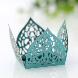 Detailed laser-cut vine pattern on cyan pearlescent paper candy box wrapping