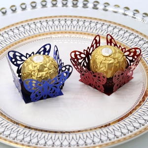 Detail of laser-cut butterfly cupcake toppers for wedding and party candy decoration