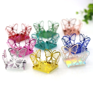 Macro shot of laser-cut hollow butterfly candy boxes in vibrant metallic finish colors