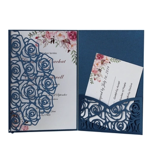 Laser-cut dark blue pearlescent paper wedding invitation with rose hollow design and floral cards