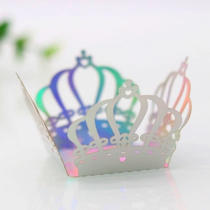 Macro detail of laser-cut crown candy box with iridescent mirror finish and heart patterns
