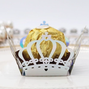 Macro detail of laser-cut crown chocolate wrapper with iridescent metallic finish