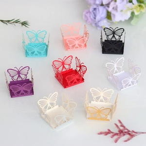 Close-up of laser-cut butterfly cupcake wrappers in various vibrant colors for parties