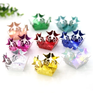 Detailed laser-cut bird hollow candy box liners in various colors for festive party decor