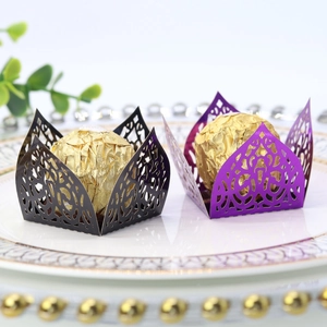 Intricate laser-cut chocolate wrappers in black and purple with delicate vine patterns