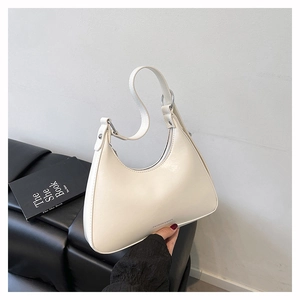 Detailed macro view of cream white crescent hobo bag with Fashion & Bags logo lettering
