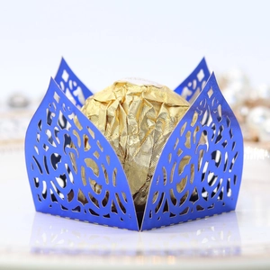 Detail of laser-cut navy blue hollow chocolate box with metallic pearlescent finish