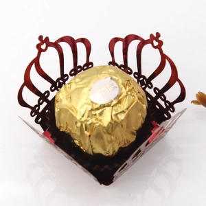 Laser-cut red metallic crown chocolate wrapper with intricate openwork lace design