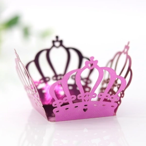 Close-up of laser-cut crown candy box with hollowed lace and metallic rose red finish