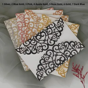 Laser cut invitation cards in seven glitter colors with ornate scrollwork patterns