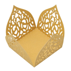 Detail of laser-cut rose hollow pattern on golden glitter paper candy box base