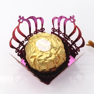 Detailed laser-cut crown candy box in metallic purple finish with intricate lace pattern