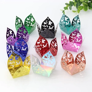 Detailed laser cut heart patterns on metallic paper candy wrappers in multiple colors