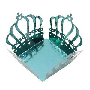 Detail of teal metallic foil crown laser-cut candy box with reflective mirror finish
