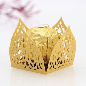Intricate gold laser-cut candy box with filigree patterns for weddings and parties
