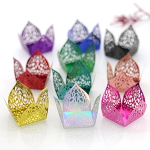 Detailed laser-cut decorative paper candy box showing various colors on a white background