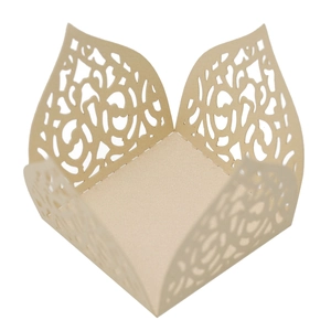 Macro detail of champagne gold laser-cut hollow lace design for cupcake wrappers