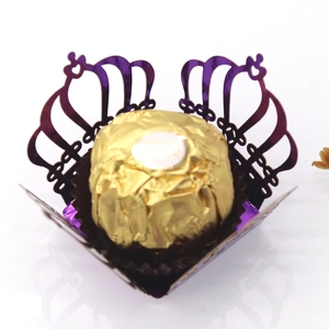 Close-up of laser-cut crown hollow chocolate wrapper in purple mirror paper