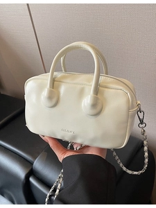 Cream white faux leather bowling bag with silver chain strap and top handle