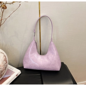 Detailed close-up of light purple lavender hobo bag with embossed crocodile leather texture