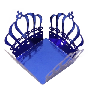 Detailed laser-cut crown cupcake wrapper in metallic blue finish with heart patterns