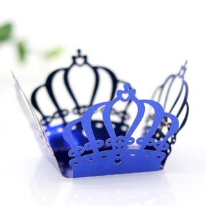 Macro view of blue laser-cut crown candy box with intricate hollow heart patterns