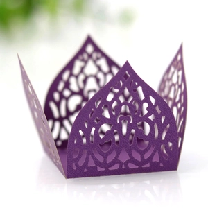 Detail of laser-cut crown pattern on purple hollow candy box with lace texture