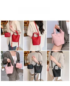 Detail view of leather bucket bag set with matching coin purse and adjustable strap