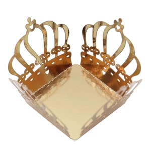 Macro detail of laser cut crown hollow pattern on gold mirror finish paper candy box