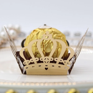 Detailed laser-cut gold hollow crown paper liner for Ferrero Rocher chocolates