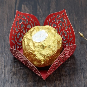 Detail of red laser-cut floral chocolate wrapper for wedding party candy decoration