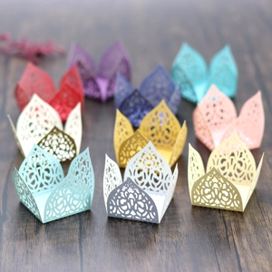 Laser-cut lace hollow candy boxes and cupcake wrappers in a wide range of vibrant colors