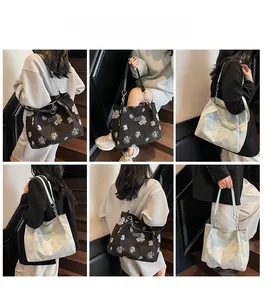 Collage of model carrying floral jacquard tote bag with chain strap on stairs