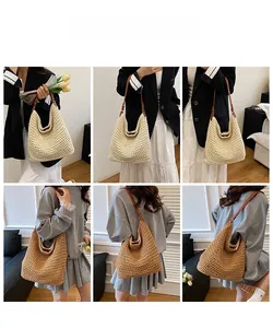 Detail of woven straw tote bags in beige and tan colors with brown leather straps