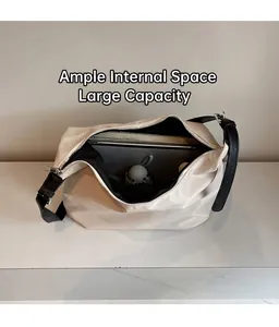 Top view showing the spacious interior of the cream white tote bag with black strap