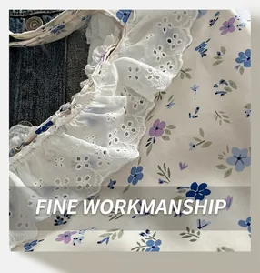 Close-up of floral pattern fabric with delicate white lace trim and intricate stitching