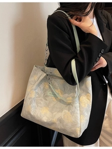 Floral canvas tote bag with light blue print and metal chain strap for women
