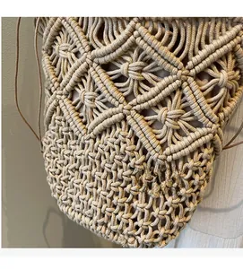 Detailed close-up of intricate hollow cotton weave texture and inner lining of a beach bag