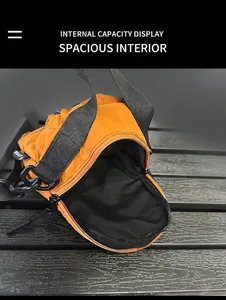 Internal capacity display of orange nylon bucket bag with black woven shoulder strap