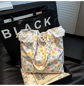 Floral canvas tote bag with delicate lace trim detail presented in a premium gift box