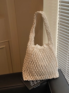 Minimalist woven bucket bag with drawstring inner pouch in cream white handmade knit style