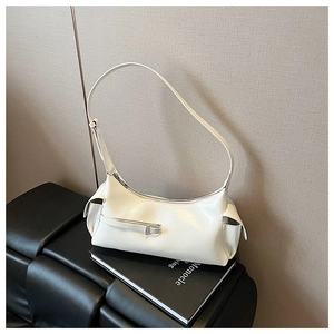 Detail of creamy white PU leather shoulder bag featuring zipper accents and sleek strap