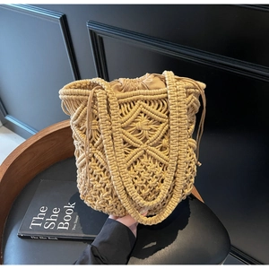 Close-up of khaki macrame woven tote bag showing geometric diamond texture and drawstring liner